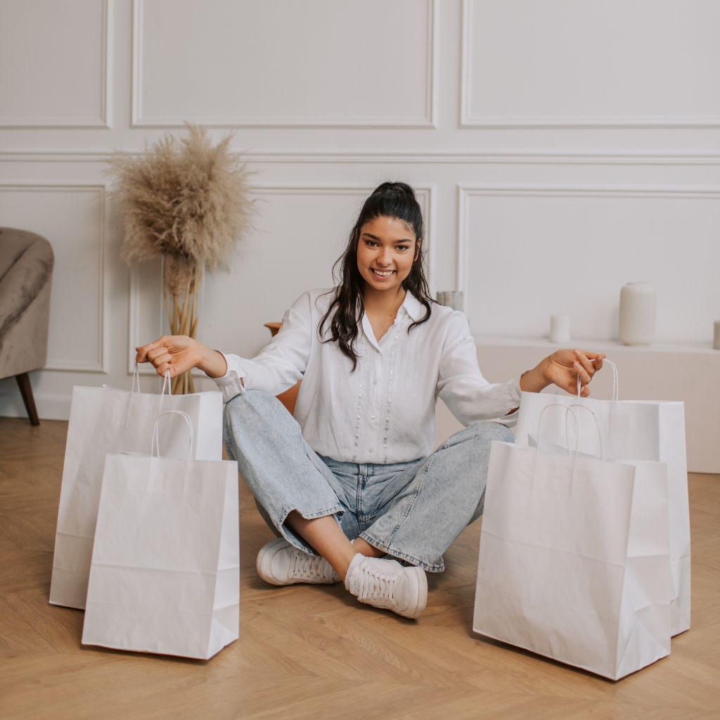 5 Strategies for Effective Organic Growth, Leveraging User-Generated Content, girl sitting on the floor at home with shopping bags